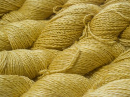 Pale, fresh yellow Baby Alpaca, silk and linen sport weight yarn. Hand-dyed by Triskelion Yarn.