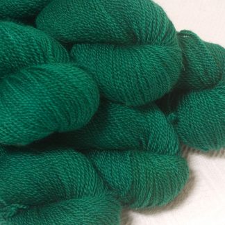 Dinas Emrys - Mid- to dark emerald green Bluefaced Leicester sport weight yarn hand-dyed by Triskelion Yarns