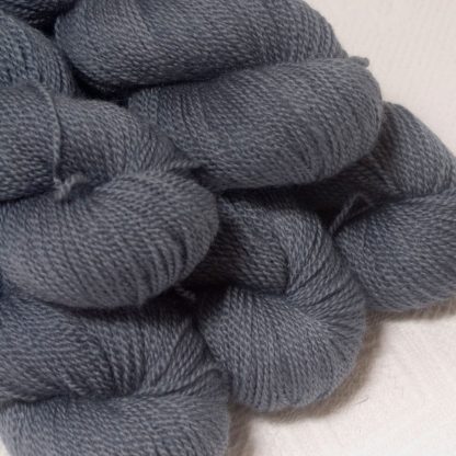 Storm - Mid- to dark bluish grey Bluefaced Leicester sport weight yarn hand-dyed by Triskelion Yarns