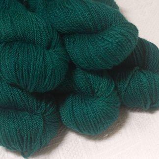 Grendel - Dark bluish-green Bluefaced Leicester worsted weight yarn hand-dyed by Triskelion Yarns
