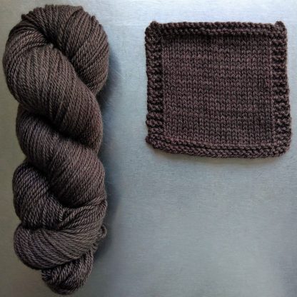 Cwrwgl - Dark cool brown Bluefaced Leicester worsted weight yarn hand-dyed by Triskelion Yarn
