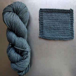 Endless Forms - Mid grey with a sea green-blue undertone Bluefaced Leicester worsted weight yarn hand-dyed by Triskelion Yarn
