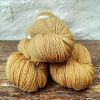 Sandbar - Sandy yellow taupe 4-ply/fingering Peruvian Highland wool sock yarn. Hand-dyed by Triskelion Yarn.