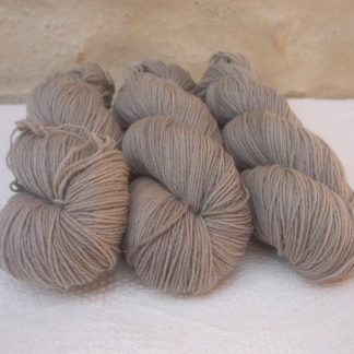Pebble - Pale greyish brown 4-ply/fingering Peruvian Highland wool sock yarn. Hand-dyed by Triskelion Yarn.