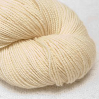 Buttermilk - Cream extra fine Merino 4-ply / fingering weight yarn. Hand-dyed by Triskelion Yarn.