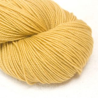 Tuscan Yellow - Warm light to mid yellow extra fine Merino 4-ply / fingering weight yarn. Hand-dyed by Triskelion Yarn.