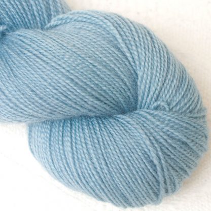 Hama's Hall - Semi-solid light sky blue, with powder blue and grey tones Corriedale 4-ply/fingering weight yarn. Hand-dyed by Triskelion Studio.