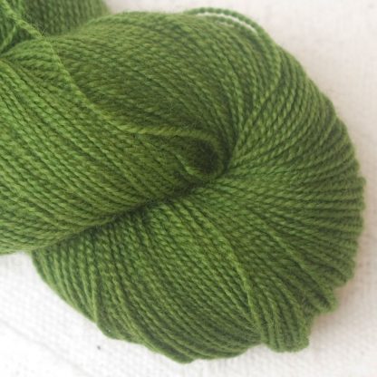 Rum and Laverbread - Semi-solid foliage green, with ochre and olive tones Corriedale 4-ply/fingering weight yarn. Hand-dyed by Triskelion Studio.