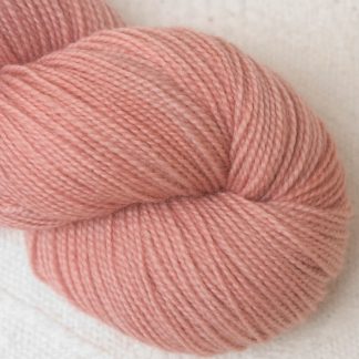 Seashell - Pale shell pink Corriedale 4-ply/fingering weight yarn. Hand-dyed by Triskelion Studio.