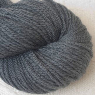 Graphite - Cool, mid-toned grey Corriedale heavy DK/worsted weight yarn. Hand-dyed by Triskelion Studio.