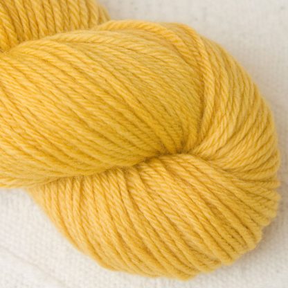 Indian Summer - Light sunny yellow Corriedale heavy DK/worsted weight yarn. Hand-dyed by Triskelion Studio.