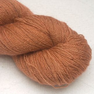 Mid-tone russet brown Bluefaced Leicester laceweight yarn hand-dyed by Triskelion Yarns