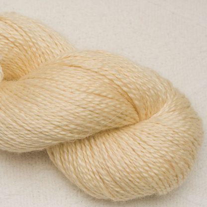 Buttermilk - Pale cream Baby Alpaca, silk and linen Mid-toned blue violet light DK yarn. Hand-dyed by Triskelion Yarn.
