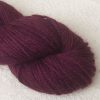Helleborine - Dark Tyrian red-purple Bluefaced Leicester (BFL) / Gotland aran weight yarn. Hand-dyed by Triskelion Yarn