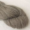Pebble - Light warm grey Bluefaced Leicester (BFL) / Gotland aran weight yarn. Hand-dyed by Triskelion Yarn
