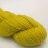 Mustard GOTS standard organic machine-washable Merino 4-ply / fingering weight yarn. Hand-dyed by Triskelion Yarn
