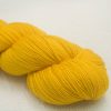Yellow GOTS standard organic machine-washable Merino 4-ply / fingering weight yarn. Hand-dyed by Triskelion Yarn