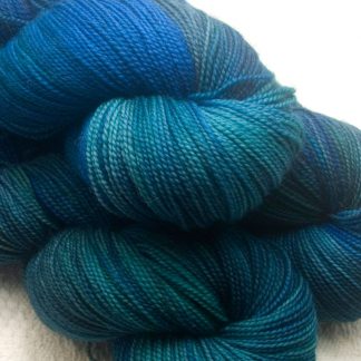 A Tale From The Riverbank - variegated blues greens and teals with flashes of silvery grey GOTS standard organic machine-washable Merino 4-ply / fingering weight yarn. Hand-dyed by Triskelion Yarn
